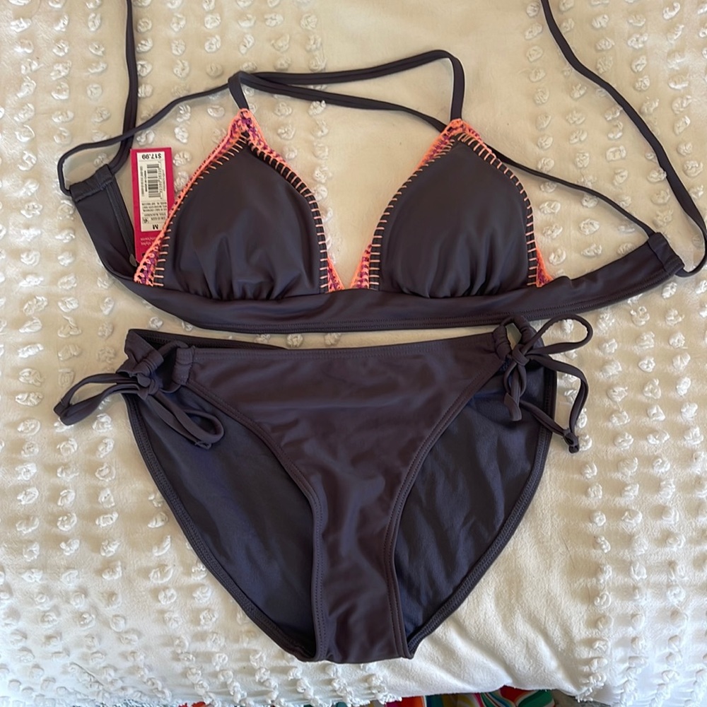 Purple triangle top bikini. Size medium. Never worn.